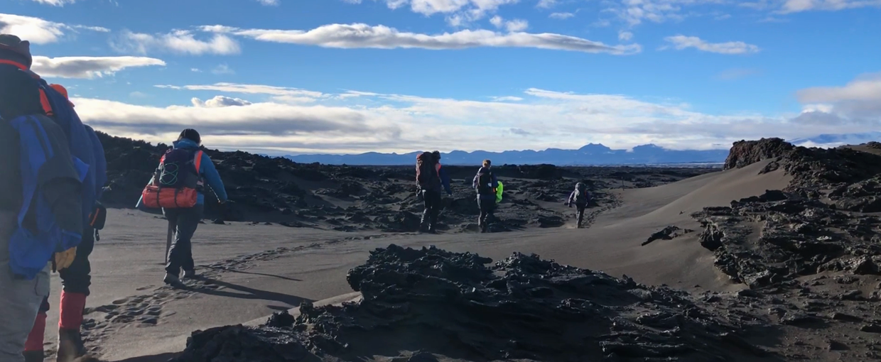 Hiking through lava field in Iceland (Credit Mike Toillion)