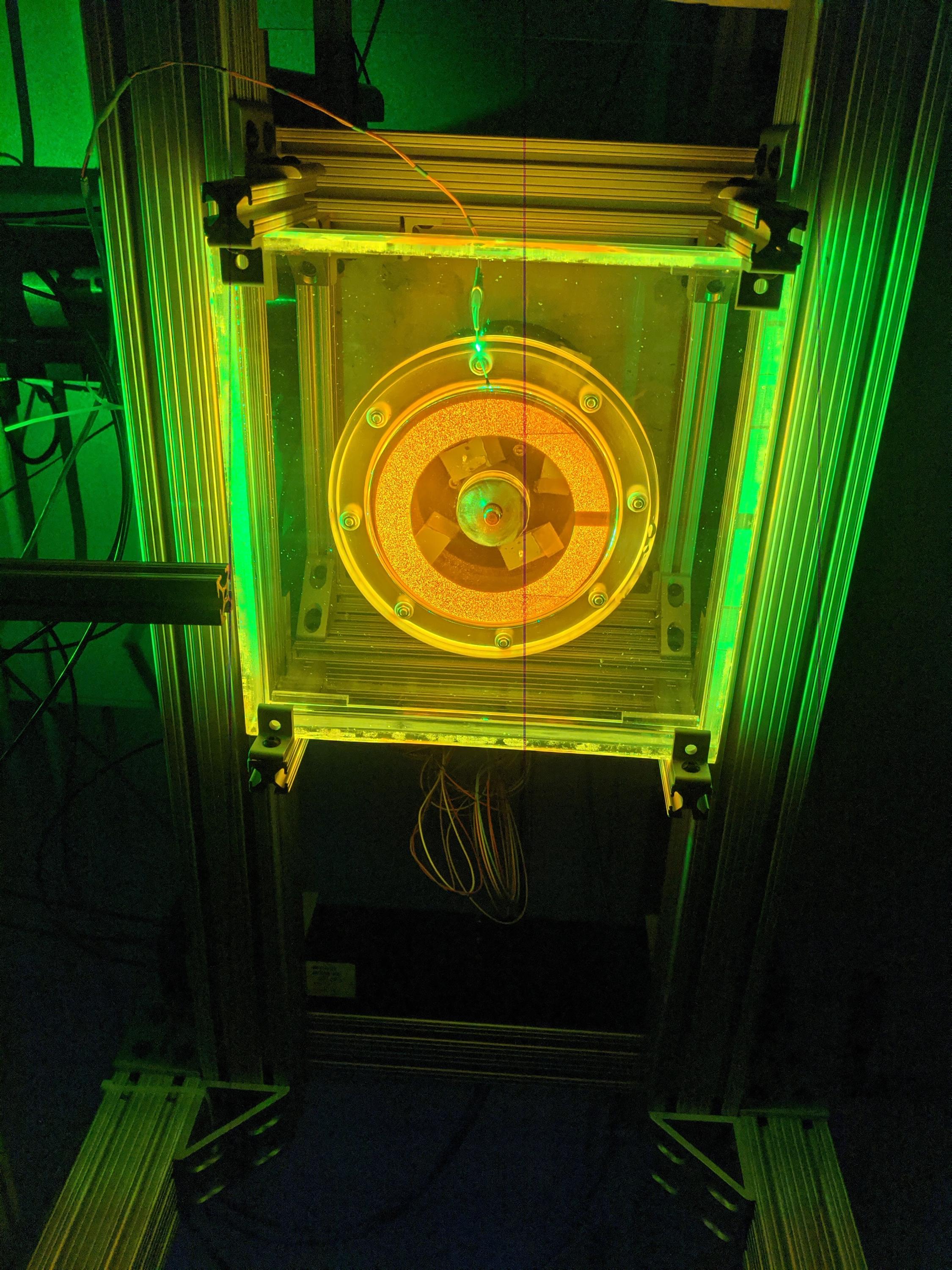The setup allowed the researchers to reconstruct the flow by tracking the motion of millions of suspended fluorescent particles. (Photo: Michael Schatz)