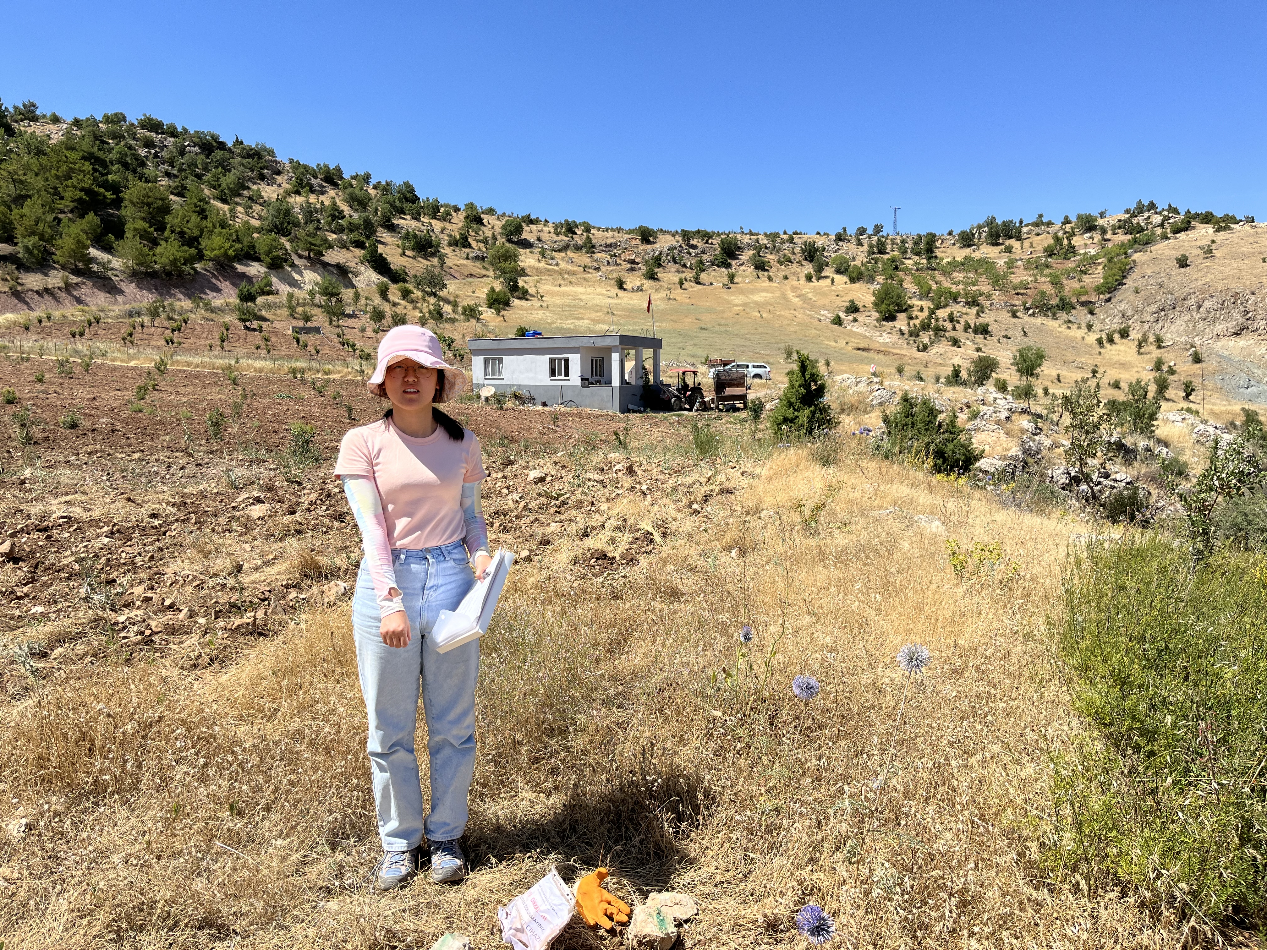 Georgia Tech graduate student Chang Ding pointing at a deployed seismic node in Southern Turkey
