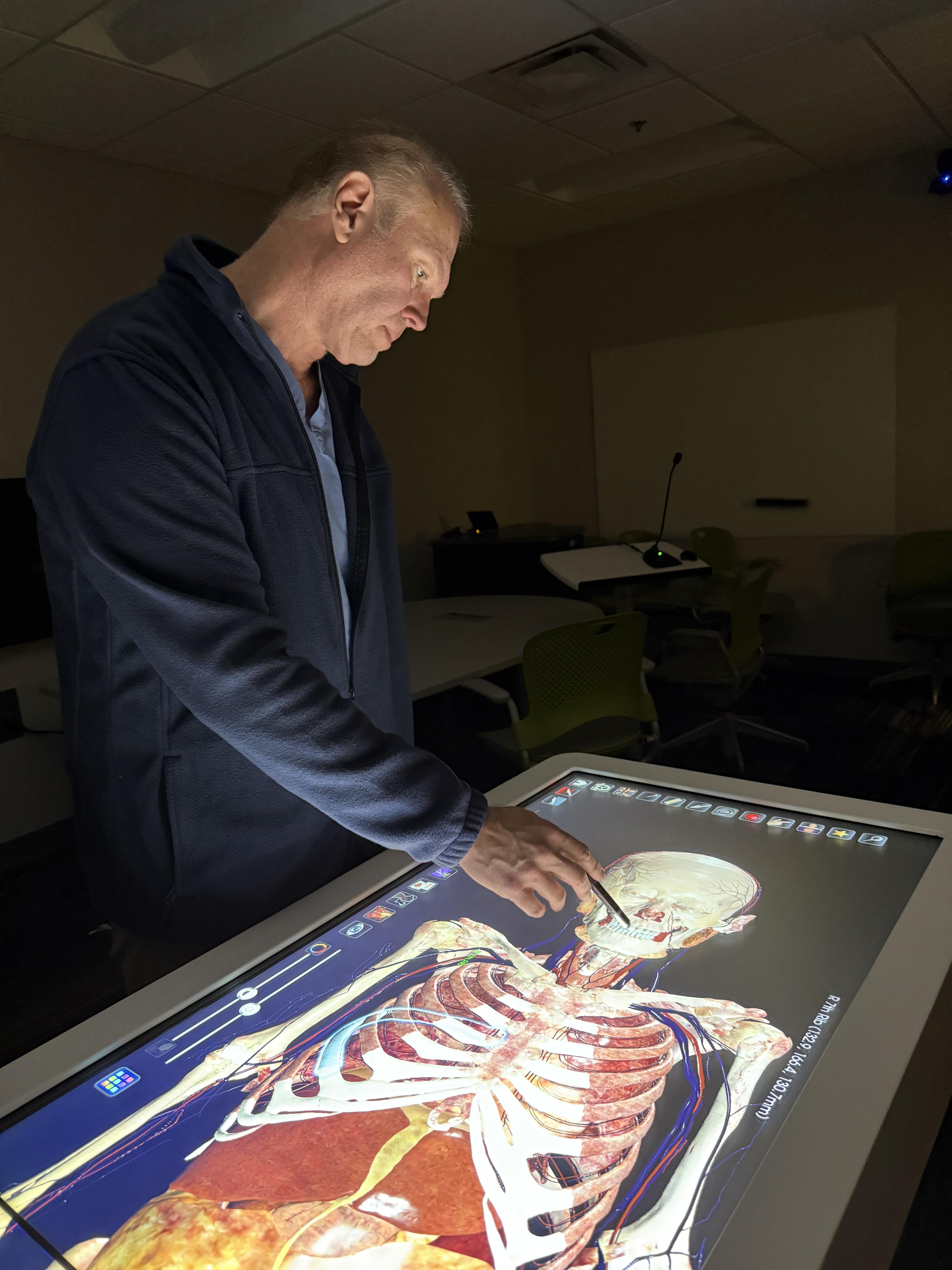 Adam Decker demonstrates how the Anatomage Table turns traditional dissection into a high-tech learning experience.