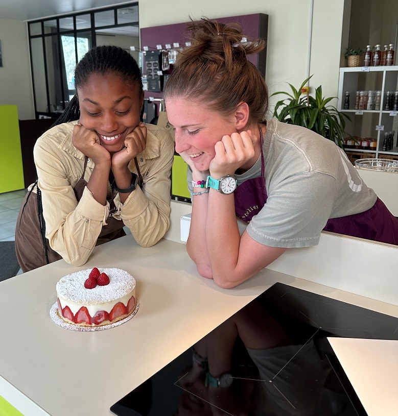 Fifth-year Chemical Engineering major Dara Jakande and third-year Chemistry major Sammy Rizzo admire their “fraisier,