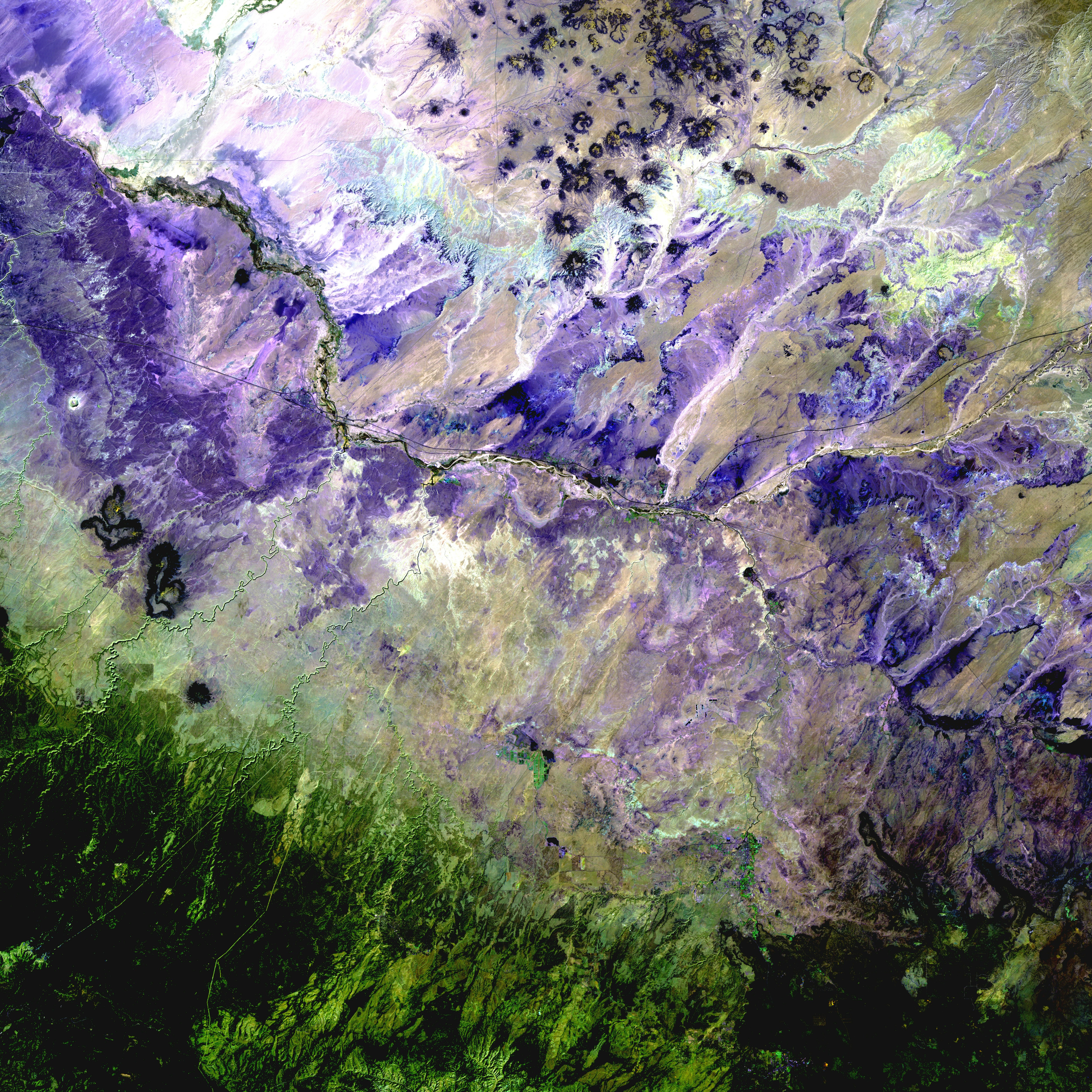 In the Painted Desert of Northern Arizona (shown here in a palette of purples), wet-dry cycling has contributed to the formation of the colorful layers visible in the landscape. (Credit: USGS)