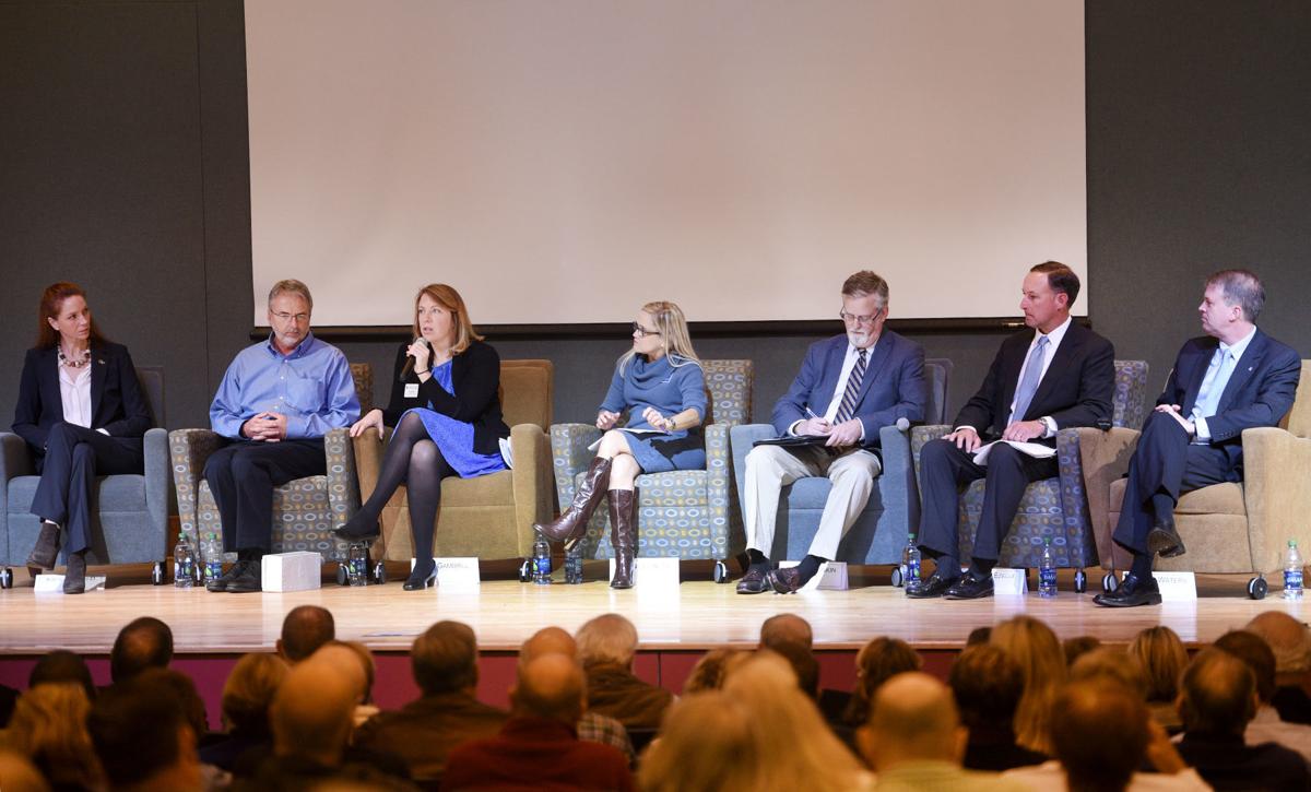 Kim Cobb (left) discussing sea-level rise with other experts (Photo by The New Brunswick News)