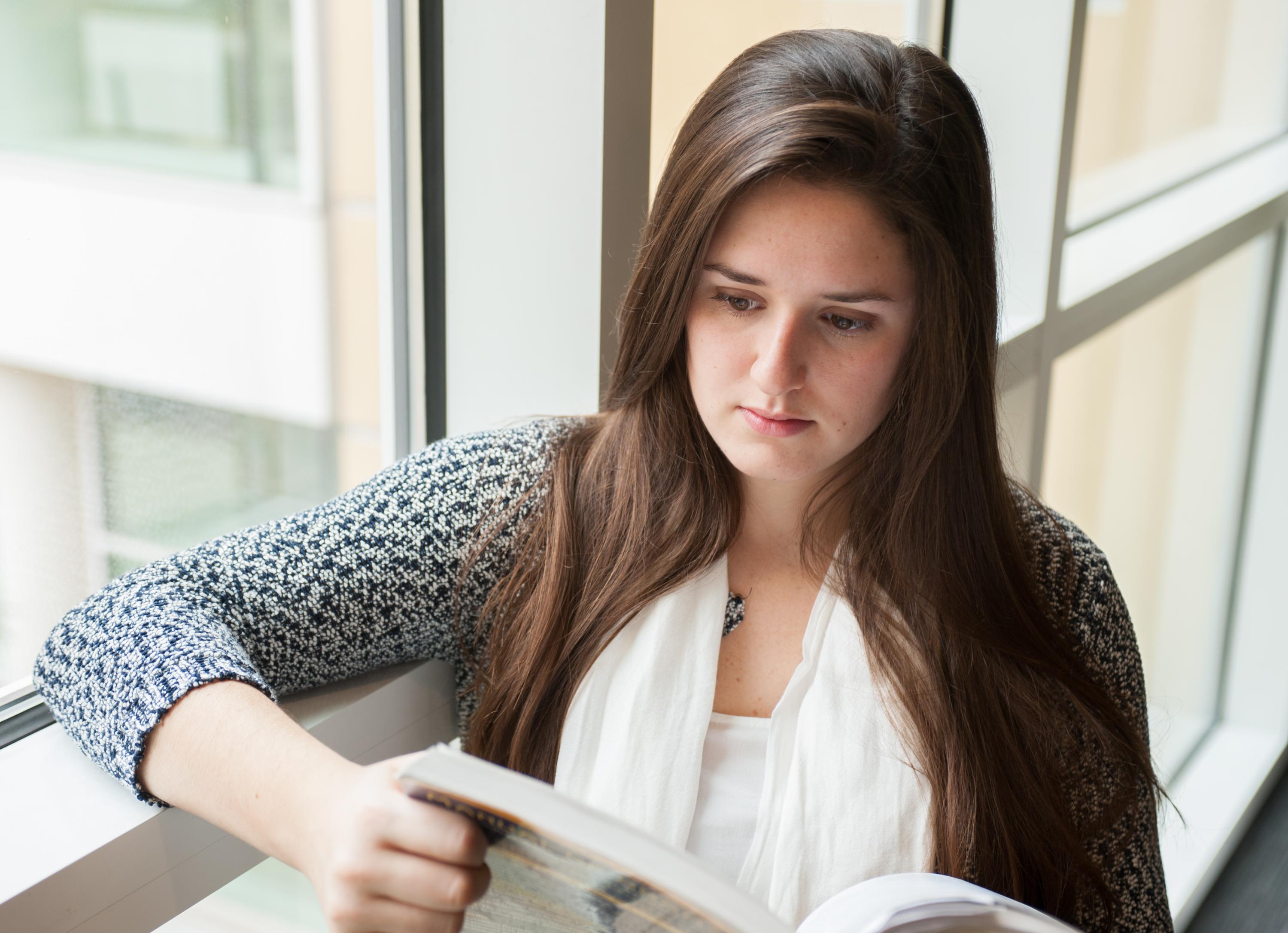 Student Reading in the Scheller College of Business. Photo: Fitrah Hamid