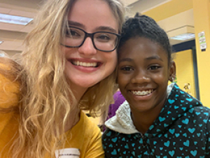 Diana Toro (left) with a student from Scott Elementary School
