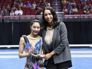 Elena Shinohara receives the Sportsperson of the Year Award from Rebecca Sereda (Credit: USA Gymnastics)