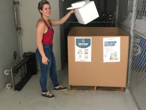 Graduate student Hannah Viola using the Gaylord collection box in Krone EBB