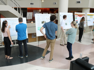 Students attending the Aquatic Chemical Ecology REU prepare for poster session presentations July 20. (Photo Renay San Miguel)
