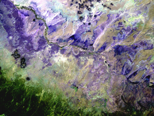 In the Painted Desert of Northern Arizona (shown here in a palette of purples), wet-dry cycling has contributed to the formation of the colorful layers visible in the landscape. (Credit: USGS)