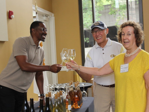 La Fête Wine Company Founder and CEO Donae Burston (Industrial Engineering 1998), Norman Chu (Electrical Engineering 1984), and Friends of Sciences Steering Committee Member Kathy Wilson-Chu raise a toast to Georgia Tech.
