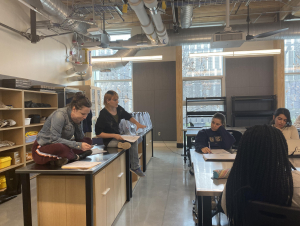 Drake Lee-Patterson (left) and Stephanie Bilodeau, co-instructors, review an assignment with students. (Photo: Grace Pietkiewicz)