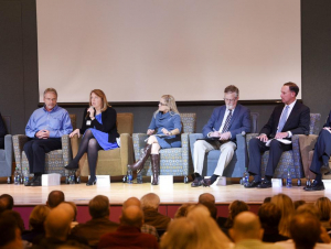 Kim Cobb (left) discussing sea-level rise with other experts (Photo by The New Brunswick News)