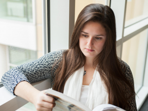 Student Reading in the Scheller College of Business. Photo: Fitrah Hamid