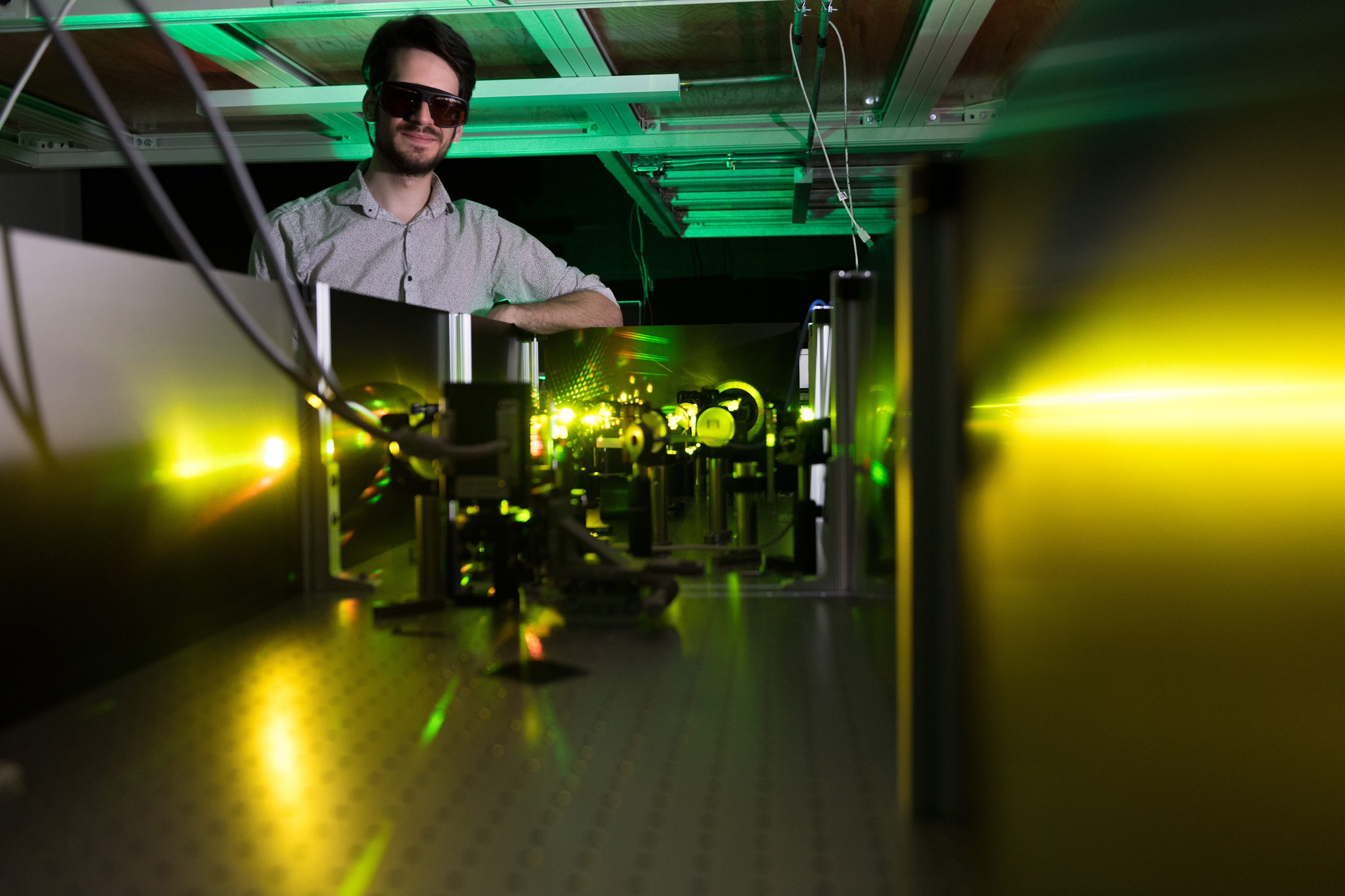 Felix Thouin in Carlos Silva lab with visible-range laser