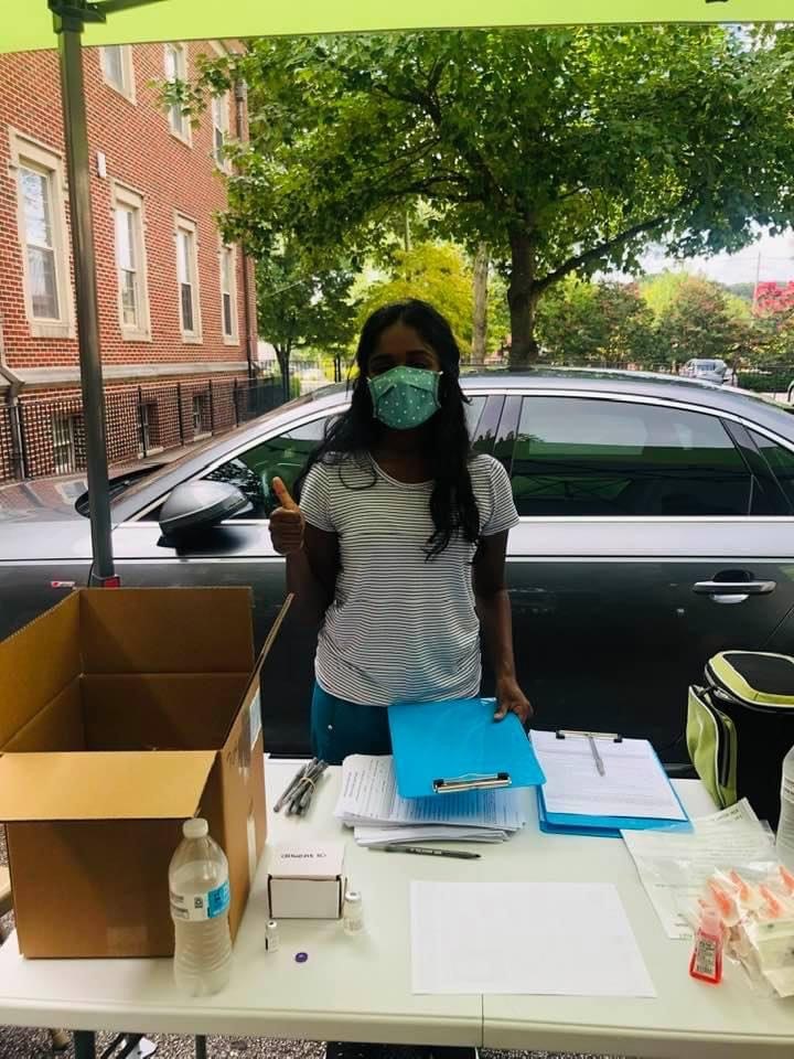Ritika Chanda volunteering with Intown Collaborative Ministries during a vaccination clinic.